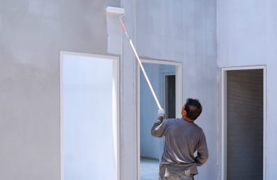asian-construction-worker-painting-white-primer-co-2025-03-11-03-50-43-utc